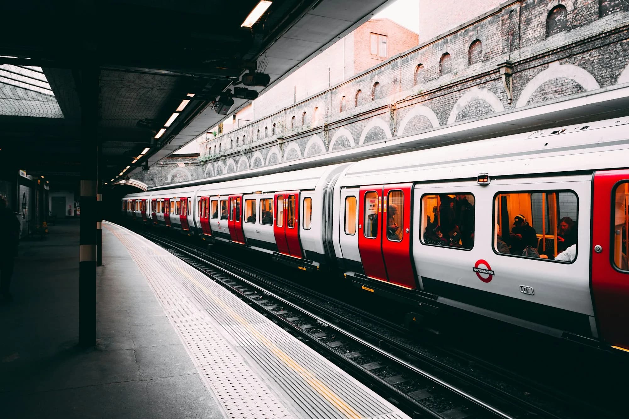 Metro train arriving at an underground platform