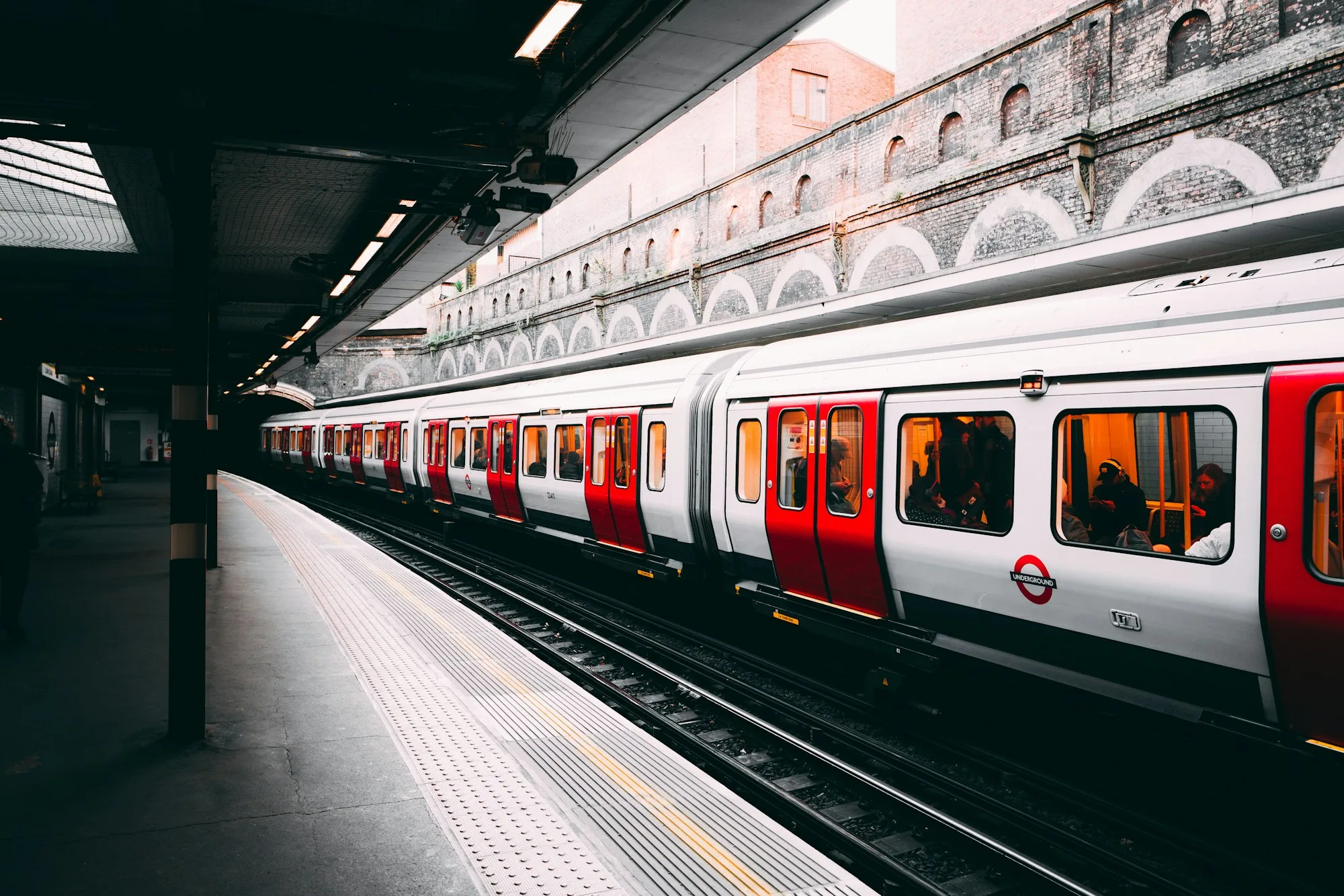 Metro train arriving at an underground platform
